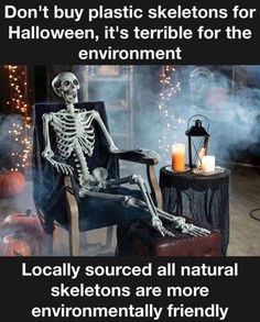 a skeleton sitting in a chair next to a candle