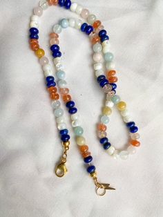 This beautiful rainbow gemstone necklace makes a perfect gift! Each bead is hand knotted onto silk thread, which gives the necklace a lovely drape. Necklace is 19 inches long, hand knotted with white silk string and has gold filled findings. This is a stunning necklace that completes any outfit. This necklace is a perfect gift!   GEMSTONES INCLUDED: Lapis Lazuli Mother of Pearl Shell Sunstone Morganite BENEFITS OF A HAND KNOTTED NECKLACE 1. A knotted necklace is safe and secure. If it should get Luxury Adjustable Rondelle Beaded Necklaces, Rainbow Gemstone Beaded Necklaces As A Gift, Rainbow Gemstone Beaded Necklaces For Gift, Rainbow Beaded Necklaces With Gemstone Beads As Gift, Rainbow Beaded Necklace With Gemstone Beads For Gift, Rainbow Crystal Necklaces With Round Beads Gift, Adjustable Single Strand Rainbow Beads, Adjustable Rainbow Single Strand Beads, Multicolor Single Strand Crystal Necklace For Gift