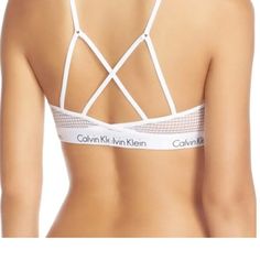 Calvin Klein Ck One Micro Bralette This Sporty Take On The Lightly Supportive Bralette Is Made From Airy Mesh And Backed By A Web Of Straps. Size: Large (L=36) Color: White Style # Qf1323-100 89% Nylon, 11% Elastane. Strappy Back Detail, Unlined Light Weight, Semi-Sheer New With Tags Fast Shipper Top Rated Seller Posh Ambassador Questions Welcome Non-Smoking Home Fitted Calvin Klein Bra For Summer, Calvin Klein Fitted Bra For Summer, Summer Mesh Bra, Fitted Calvin Klein Summer Bra, Summer Bra With Mesh Back, Calvin Klein Ck One, Ck One, Calvin Klein White, White Style