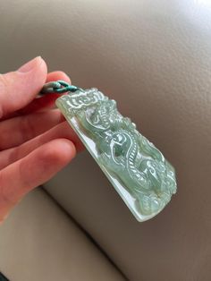 🌈 Chinese Dragon Jadeite Jade Pendant, Light Green 🌷 Untreated Natural Jadeite/ Grade A Jade 🌷 Jade from Myanmar / Burma 🌷 100% handmade carving 🌷 Dimensions : 61.7 x 43.6 x 6mm 🌷 Color : Light Green 🌷 Free standard shipping from Hong Kong with tracking included 🌷 Take approximately 7-21 days to arrive worldwide ❤️ Dragon Mythology and Symbolism Dragon is the most powerful and imperial creature in Chinese mythology, thus, the traditional and unsurpassed status in Feng Shui. The Chinese e Green Carved Amulet Necklace, Green Carved Healing Necklace, Healing Green Carved Necklaces, Healing Green Carved Necklace, Green Carved Necklaces For Healing, Artisan Carved Jade Jewelry, Dragon Mythology, Chinese Emperor, Chinese Mythology