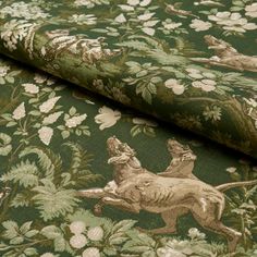 a green and gold wallpaper with animals on it's back side, in the middle