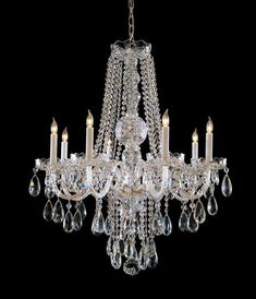 a crystal chandelier hanging from the ceiling