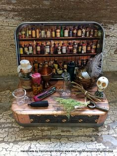 an old suitcase is filled with bottles and other things to make it look like they are on the table