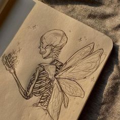 a drawing of a skeleton holding a flower