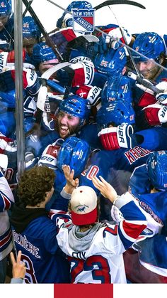 a group of hockey players standing next to each other