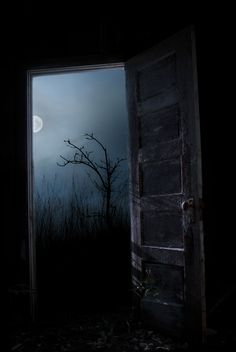 an open door leading into a dark room with the moon in the sky behind it