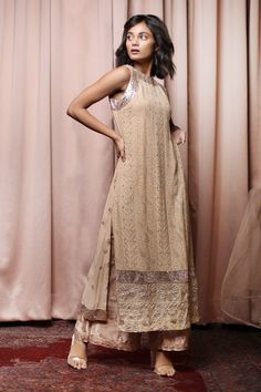 Beige kurta with all-over chikankari embroidery and round neckline. Comes with palazzo.
Component: 2
Embroidered
Neckline: Round
Sleeve Length: Sleeveless
Fabric: Georgette, Dupion Silk, Net
Color: Beige
Chikankari and aari embroidery
Straight kurta
Embroidered palazzo - Aza Fashions Semi-stitched Chikankari Kurta For Reception, Traditional Embroidered Cutdana Wedding Dress, Traditional Wedding Embroidered Dress With Cutdana, Traditional Embroidered Wedding Dress With Cutdana, Semi-stitched Embroidered Dress For Navratri, Beige Resham Embroidered Fabric For Reception, Chikankari Embroidery Salwar Kameez For Eid Reception, Eid Chikankari Embroidered Dress With Traditional Drape, Traditional Embroidered Dress With Mirror Work For Designer Wear