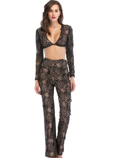 The long sleeve crop top provides a distinctive way of covering up. Its left side is see-through and unlined, creating an intriguing effect when layered over other pieces or worn alone. For a head-to-toe style, team it up with the matching high-rise crochet pants to complete the outfit. This crop top is perfect for anyone who wants to make a statement and stand out from the crowd. Style: sexyStyle: jumpsuitPant type: straight tube typePant length: trousersPopular elements: sequins, embroideryColor: blackSize: S,M,L,XL Elegant Two-piece Long Sleeve Sets For Night Out, Sheer Long Sleeve Sets For Summer, Sheer Long Sleeve Summer Sets, Cropped Two-piece Party Bottoms, Party Cropped Two-piece Bottoms, Spring Long Sleeve Sets For Night Out, Long Sleeve Sets For Spring Night Out, Spring Night Out Long Sleeve Sets, Party Crop Top With Sheer Sleeves