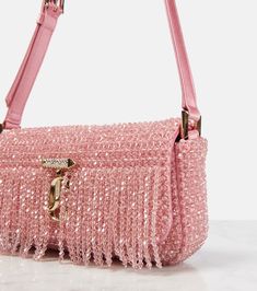 Find JIMMY CHOO Avenue Mini Embellished Shoulder Bag on Editorialist. The Jimmy Choo Avenue Mini shoulder bag features a beaded exterior with a fringe detail. The bag has a magnetic-tab fastening and an adjustable shoulder strap. The bag includes a satin lining and a slot pocket. Made in Italy, this bag comes with a box and dust bag. Pink Beaded Bag, Classic Designer Handbags, Diy Bags No Sew, Fancy Purses, Jimmy Choo Bags, Leopard Handbag, Hand Beaded Bag, Expensive Bag, Bead Bag