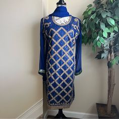 Have A Indian Or Pakistani Wedding Event Coming Up And Need An Ethnic, Exotic Outfit? Look No Further With This Gorgeous 3 Piece Outfit That Consists Of A Top (Kameez), Bottom (Salwar) And Shawl (Dupatta). Top (Kameez) Has Sheer Long Sleeves Sleeves With A Jacquard Green And Gold Trim. The Front Has Criss Cross Detail In Gold With Stones, Sequins, Beads. Falls Slightly Below Knees. The Top Is Sheer And Overlays A Jacquard Layer. Size Large (Aka Size 42). Pants Are Royal Blue With A Floral Blue Print. The Last Of Waist. A Couple Of Pulls Near The Lower Thigh That Won’t Show Once The Entire Outfit Is On (See 2nd To Last Pic). Shawl (Dupatta) Is Sheer Royal Blue With A Jacquard Border. Designer Blue Embroidered Salwar Kameez, Blue Traditional Wear With Dabka Work For Eid, Traditional Blue Kurta For Reception, Bollywood Style Royal Blue Dupatta For Eid, Royal Blue Bollywood Dupatta For Eid, Diwali Long Sleeve Embellished Churidar, Long Sleeve Embellished Churidar For Diwali, Royal Blue Semi-stitched Salwar Kameez With Zari Work, Royal Blue Zari Work Salwar Kameez Semi-stitched