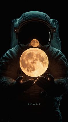 an astronaut holding the moon in his hands