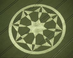 an aerial view of a crop circle in the middle of a field with a star drawn on it