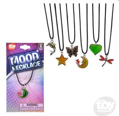 four necklaces with different designs and colors are shown in front of a card board