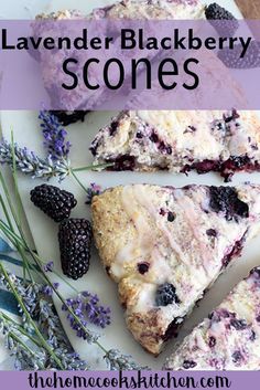 blueberry scones on a white plate with blackberries and lavender sprigs