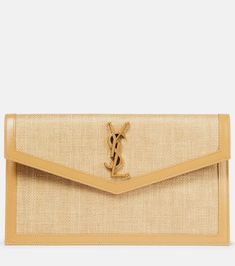 Uptown leather-trimmed raffia clutch in neutrals - Saint Laurent | Mytheresa Designer Beige Clutch With Gold-tone Hardware, Designer Envelope Clutch For Travel, Designer Travel Envelope Clutch, Luxury Beige Envelope Clutch, Parisian Glamour, Saint Laurent Clutch, Raffia Clutch, Saint Laurent Bag, Fabric Trim