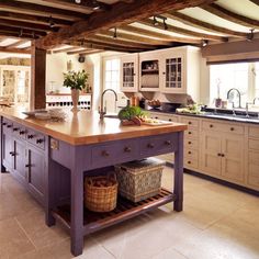 a large kitchen with an island in the middle