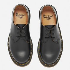 These Dr. Martens ‘1461’ Leather Shoes are produced using a Goodyear welt, which is designed to keep their construction as robust and durable as possible. With a three-eyelet lace upper, a thick outsole with bold yellow stitching, and a heat-sealed insole, the ‘1461’ shoe is as stylish as it is comfortable. For happy feet, there is no better choice than Dr. Martens. The Dr. Martens brand was founded in 1948, and has been producing top quality work and leisure footwear ever since. Upper/Lining: L Classic Leather Shoes With Studded Rubber Outsoles, Classic Black Leather Shoes With Studded Outsoles, Black Shoes Women, Dr Martens Shoes, Martens Shoes, Quality Work, Goodyear Welt, Eyelet Lace, Shoe Collection