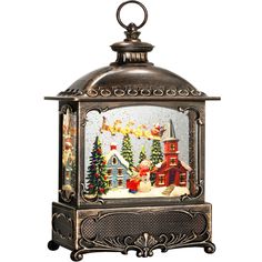 a decorative lantern with christmas scenes on it