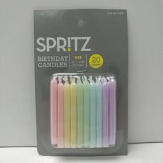 a package of birthday candles in pastel colors