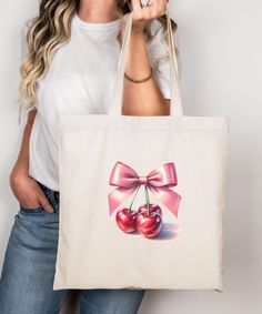 Aesthetic coquette tote bag, pink bow and cherries gift for coquette, canvas tote coquette art print gift for her, cute red cherry design. This 100% cotton bag comes in one size - 15" x 16"- perfect for everyday wear. While the canvas material will show off your designs in great colors, it's durable and will last for years. The bag features 20" handles (made from the same canvas), making it easy to carry even with a week's worth of shopping. .: 100% cotton canvas .: Heavy fabric (12 oz/yd² (406.9 g/m .: Sewn-in label Cute Bag With Bow For Gift, Cute Pink Canvas Bag For Gift, Cute Canvas Tote Bag For Gift, Feminine Summer Bags For Gifts, Feminine Summer Gift Bags, Trendy Summer Canvas Gift Bag, Retro Canvas Tote Bag For Gift, Trendy Pink Canvas Bag For Gift, Trendy Pink Canvas Bag As Gift