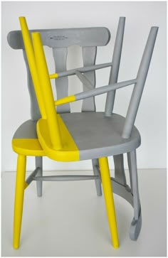 two chairs with yellow and grey seats on them