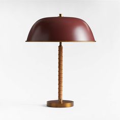 a table lamp with a wooden base and a red shade on it's top