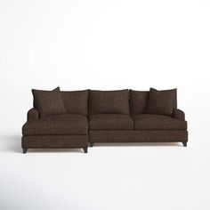 a brown couch sitting on top of a white floor