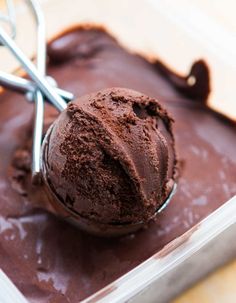 a scoop of chocolate ice cream in a container