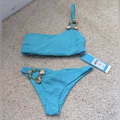 Brand New Beach Bunny Bikini. Embellished One Shoulder Top Size Small. Embellished Skimpy Bottom Size Extra Small. Hygiene Liner Missing As It Peeled Off When I Remove The Tissue Protecting The Embellishment. Beautiful Blue Color, Perfect For Your Next Vegas Pool Party Or Vacation. Embellished Swimwear For Summer Pool, Embellished Swimwear For Summer Pool Season, Embellished Swimwear For Pool And Summer, Embellished Swimwear For Pool And Beach Season, Embellished Swimwear For Summer Beachwear, Embellished Swimwear For Summer, Embellished Beachwear Swimwear For Summer, Embellished Beachwear Swimwear For Party, Embellished Fitted Swimwear For Beach Season