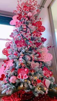 a decorated christmas tree with lots of hearts