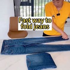 a man in yellow shirt and jeans laying on bed