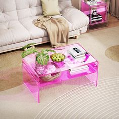 a living room filled with furniture and a pink coffee table