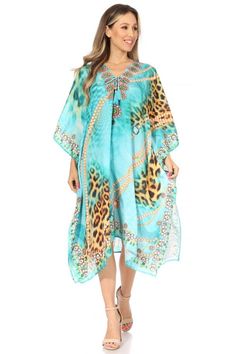 This caftan dress cover up features a beautiful handmade cut. It has a beautiful multi toned tribal pattern print with a v-neck and rhinestone embellishments around the neckline. The dress is long and tall, and has adjustable drawstrings at the neckline that can be left undone or tied as desired. The dress is very lightweight and airy. Beach Vacation Outfits, Beach Cover Ups, Rhinestone Embellishments, Caftan Dress, Holiday Wardrobe, Cut It, Dress Cover, Beach Covers, Vacation Outfits