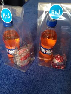 two bottles of rum in plastic bags on a blue carpet