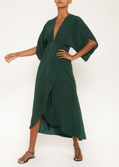 The Kelly is a 100% silk full-length dress, displaying a backless print, wrap skirt, plunging neckline, and a long petal leaf sleeve. It offers a sophisticated silhouette, making it suitable for night or day occasions. Our pieces are majority made to order ensuring that no fabric is wasted and energy is conserved. Once Silk Backless Dress, Leaf Sleeve, Emerald Dress, White Silk Dress, Silk Dress Short, Poncho Dress, Nyc Dresses, Resort Wear Dresses, Emerald Dresses