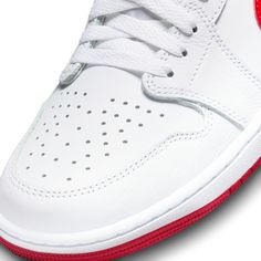 From hoops to fashion, the AJ1 forever changed the footwear game. Building upon its legacy, this striking edition pairs premium White leather with bright hits of University Red for an ultra-clean finish. Nike Air branding on the tongue is complemented by the embroidered Wings logo on the heel. Step into a fresh pair and change your game.Encapsulated Air unit provides lightweight cushioning.Leather and textile materials in the upper are light and durable. Sporty Red High-top Sneakers With Perforations, Red Leather High-top Sneakers With Perforated Toe, Red Leather High-top Sneakers With Perforations, Red High-top Sneakers With Perforations For Streetwear, Red High-top Custom Sneakers With Perforations, Red High-top Sneakers With Perforated Toe Box, Red Basketball Shoes With Perforated Toe Box, Red Skate Shoes With Perforated Toe Box For Sports, Red Basketball Shoes For Sports