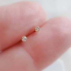 Teeny, tiny sparkling CZ studs in 14k gold plated 316L Surgical steel. Sold as a PAIRThese are very small and are best suited for piercings higher up on the ear where the flesh is thinner, or the piercing hole size is small. (2nd, 3rd, & cartilage piercings)PLEASE NOTE: For hygienic reasons earrings that are not defective or sent in error cannot be returned. Please choose carefully. Thank you.• T H E • D E T A I L S • • All components are 14k gold plated 316L Surgical steel with Gold fill ba Dainty Diamond White Earrings With Sparkling Stones, Cubic Zirconia Earrings With Bezel Setting For Gifts, Dainty Round Crystal Earrings With Cubic Zirconia, Dainty Round Cubic Zirconia Crystal Earrings, Dainty Cubic Zirconia Crystal Earrings For Anniversary, Dainty Diamond Earrings With Sparkling Stones For Gift, Everyday Cubic Zirconia Birthstone Earrings, Dainty Hypoallergenic Crystal Earrings For Anniversary, Everyday Birthstone Cubic Zirconia Earrings