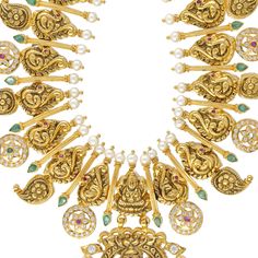 Indulge in the allure of this 22k gold temple necklace by Virani Jewelers—a masterpiece that radiates majestic opulence. Crafted with meticulous precision and attention to detail, this stunning Laxmi necklace embodies the grandeur of Indian jewelry heritage. Adorn yourself with elegance, draping your neckline in the splendor of authentic Indian gold jewelry that whispers tales of regal charm and refined taste. Features • 22k yellow gold • Emerald • Ruby • Pearl • Cubic zirconia Specifications • Gold Temple Necklace, Temple Necklace, Indian Gold Jewelry, Gold Bead Necklace, Authentic Indian, Gold Jewelry Indian, Pearl Gemstone, 22k Gold, Gold Beads