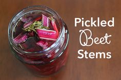 pickled beet stems in a glass jar with the words pickled beet stems