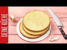 three pieces of bread sitting on top of a white plate next to a knife