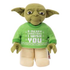 a star wars yoda plush toy is wearing a green sweater and tan pants with the words merry christmas i wish you on it