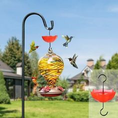 a bird feeder with birds flying around it