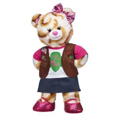 a brown and white teddy bear wearing pink shoes