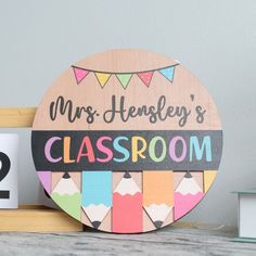 a wooden sign that says mrs hensley's classroom with pencils on it