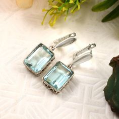 Aquamarine Earring    Large Emerald cut Aquamarine dangle, Ocean blue gemstone drop earrings, gift for her, gift for mom, March birthstone,925 Sterling Silver Dangle/earring  teardrop lab created Gemstone earrings gemstone-10x14mm gemstone-lab grown <> Some basic benefits of wearing Aquamarine Gemstone: Attracts money. Brings good fortune. Financial abundance. Protects from negative energies. Cleanses all evil thoughts. Stability in married life. Improves communication. Boosts self-confidence. FREE SHIPPING AND USPS TRACKED PARCELS WORLDWIDE. Our products are totally handmade and made with high quality gemstones and 925 solid sterling silver If you believe in buying top quality products for yourself and for your family and friends, SE is the place where you want to be There are unique piec Evil Thoughts, Gemstone Drop Earrings, Aquamarine Earrings, March Birthstone, Sterling Silver Dangle Earrings, Large Earrings, Blue Gemstones, March Birth Stone, Ocean Blue