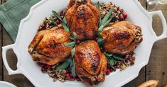 a white platter filled with roasted turkey and stuffing