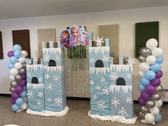 a frozen princess birthday party with balloons and decorations