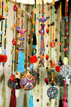 an assortment of colorful beads hanging from the ceiling