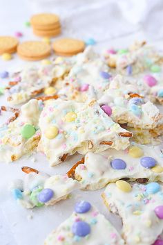 an assortment of easter sprinkles and cookies on a white surface with text overlay