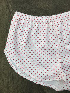 Red Heart Shorts. Great to wear for your next festival. Super cute high cut summer shorts. Super cute and really comfy shorts. Made from cotton with an elastic waist band. Great gift for a birthday, holiday or even a treat for yourself. All of my shorts are made to order so if you have a special request you can leave me a note with your order telling me your exact size specifications. If you don't see your size, if you need the shorts bigger or smaller just tell me and I can make it whatever siz Short Length Bottoms With Built-in Shorts For Pajama Party, Cotton Shorts For Pajama Party, Cute Summer Loungewear Shorts, Cute Shorts For Summer Pajama Party, Cute Stretch Bottoms Of Short Length, Cute Short Bloomers With Elastic Waistband, Cute Summer Bottoms For Pajama Party, Summer Shorts For Pajama Party, White Heart Print Bottoms For Summer